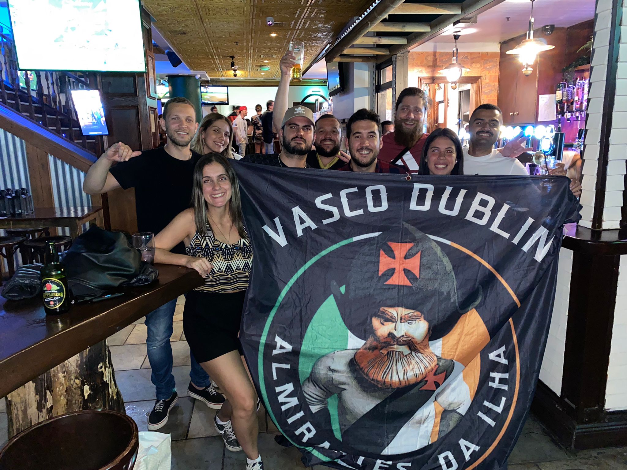 Vasco fans and flag at a bar